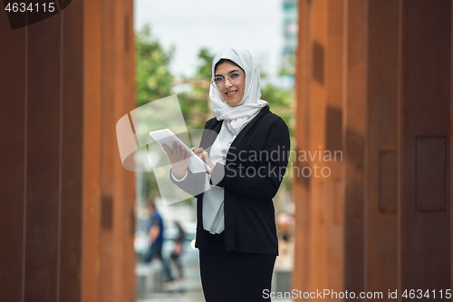 Image of Beautiful muslim successful businesswoman portrait, confident happy CEO