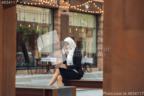 Image of Beautiful muslim successful businesswoman portrait, confident happy CEO