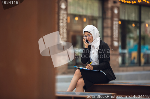 Image of Beautiful muslim successful businesswoman portrait, confident happy CEO