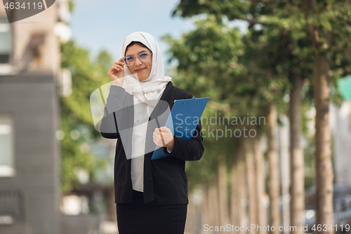 Image of Beautiful muslim successful businesswoman portrait, confident happy CEO