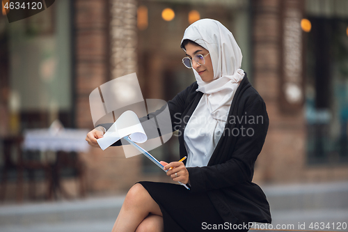 Image of Beautiful muslim successful businesswoman portrait, confident happy CEO