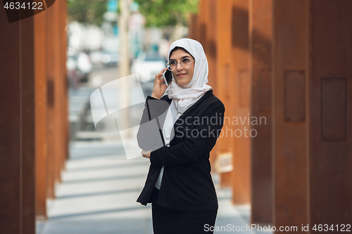 Image of Beautiful muslim successful businesswoman portrait, confident happy CEO