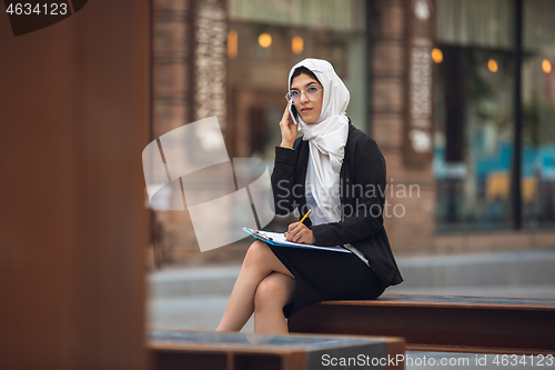 Image of Beautiful muslim successful businesswoman portrait, confident happy CEO