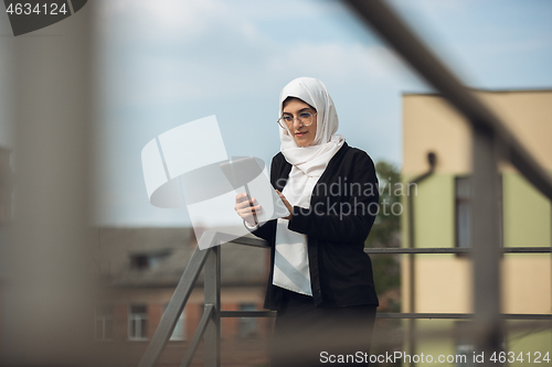 Image of Beautiful muslim successful businesswoman portrait, confident happy CEO