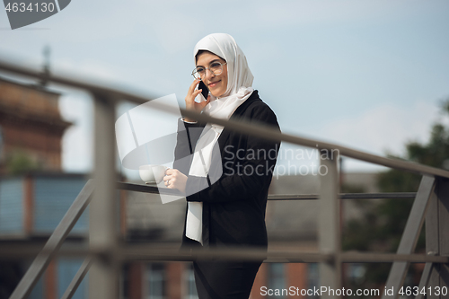 Image of Beautiful muslim successful businesswoman portrait, confident happy CEO