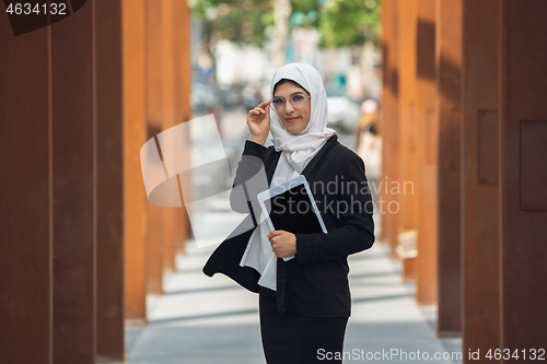 Image of Beautiful muslim successful businesswoman portrait, confident happy CEO