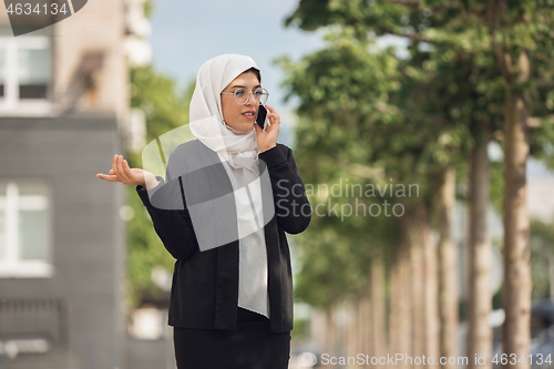 Image of Beautiful muslim successful businesswoman portrait, confident happy CEO