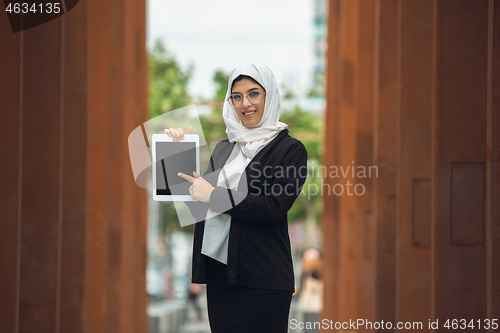 Image of Beautiful muslim successful businesswoman portrait, confident happy CEO