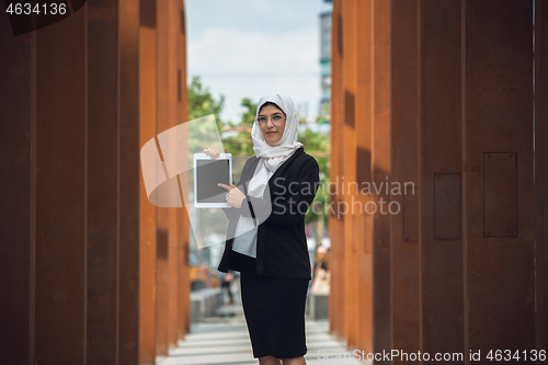 Image of Beautiful muslim successful businesswoman portrait, confident happy CEO