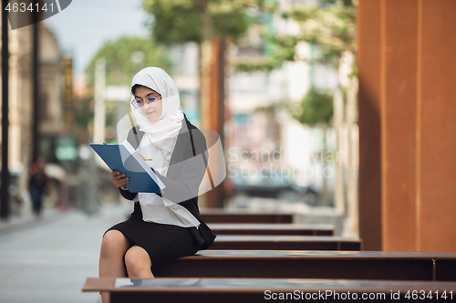 Image of Beautiful muslim successful businesswoman portrait, confident happy CEO