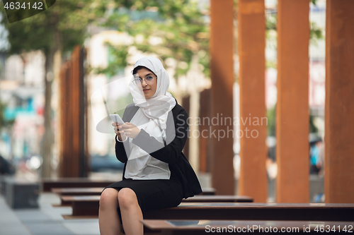 Image of Beautiful muslim successful businesswoman portrait, confident happy CEO