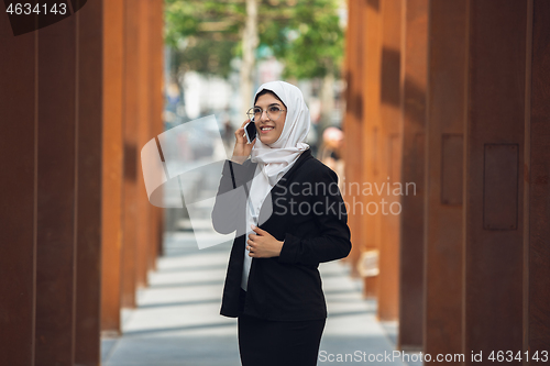 Image of Beautiful muslim successful businesswoman portrait, confident happy CEO