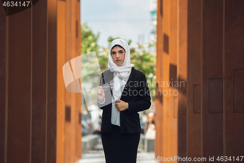 Image of Beautiful muslim successful businesswoman portrait, confident happy CEO