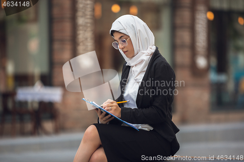 Image of Beautiful muslim successful businesswoman portrait, confident happy CEO