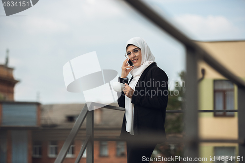 Image of Beautiful muslim successful businesswoman portrait, confident happy CEO