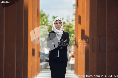 Image of Beautiful muslim successful businesswoman portrait, confident happy CEO