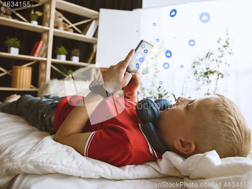 Image of Boy connecting and sharing social media. Modern UI icons, communication, devices