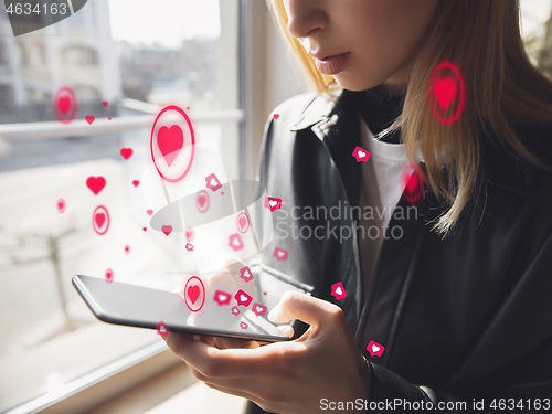 Image of Girl connecting and sharing social media. Modern UI icons, communication, devices