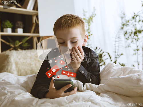 Image of Boy connecting and sharing social media. Modern UI icons, communication, devices