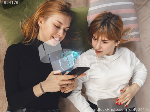 Image of Women connecting and sharing social media. Modern UI icons, communication, devices