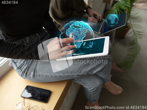 Image of Close up female hands connecting and sharing social media. Modern UI icons, communication, devices