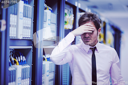 Image of young it engeneer in datacenter server room