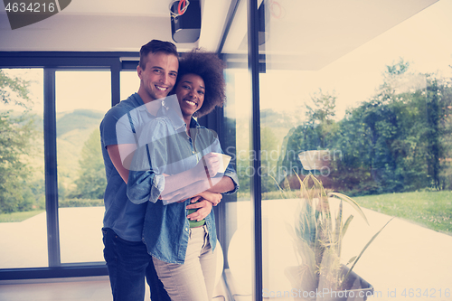 Image of romantic happy young couple relax at modern home indoors