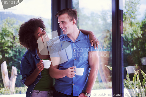 Image of romantic happy young couple relax at modern home indoors