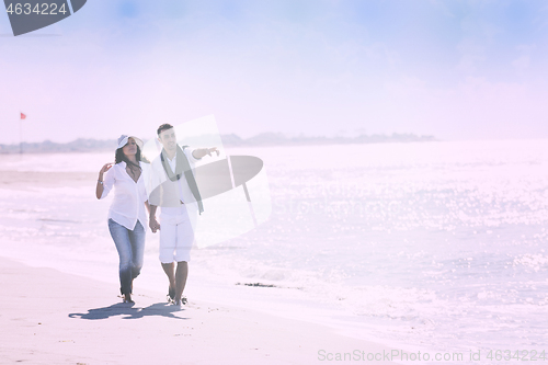 Image of happy young couple have fun at beautiful beach