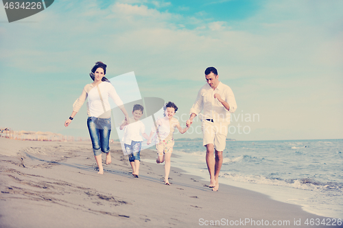 Image of happy young family have fun on beach