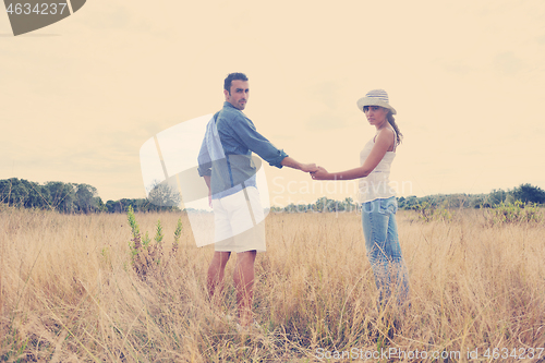 Image of happy young couple have romantic time outdoor