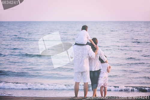 Image of happy young family have fun on beach