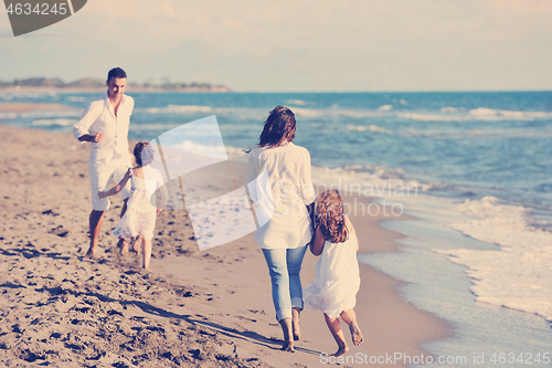 Image of happy young  family have fun on beach