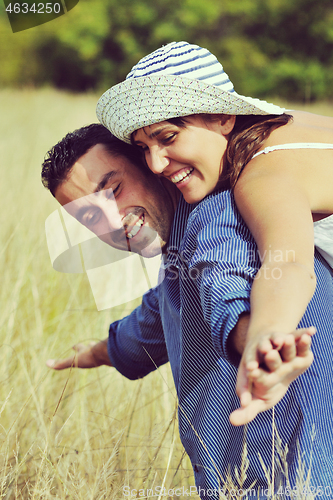 Image of happy young couple have romantic time outdoor