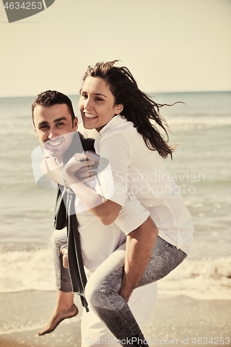 Image of happy young couple have fun at beautiful beach