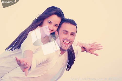 Image of young couple  on beach have fun