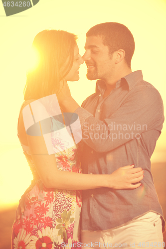 Image of happy young couple have romantic time on beach