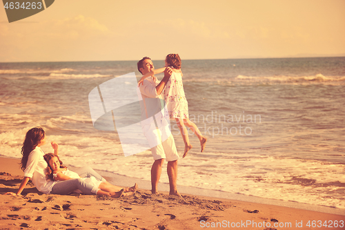 Image of happy young  family have fun on beach