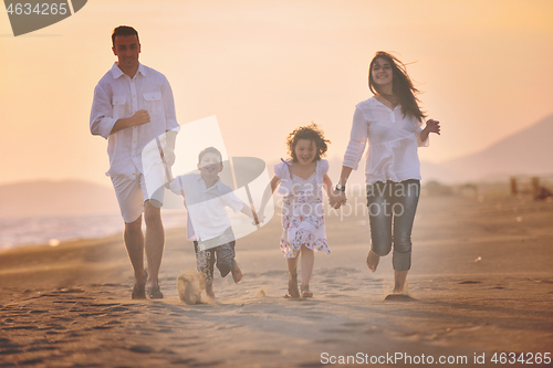 Image of happy young family have fun on beach