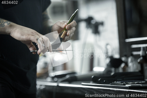 Image of Tools for cutting beard barbershop top view. Vintage tools of barber shop on wooden background