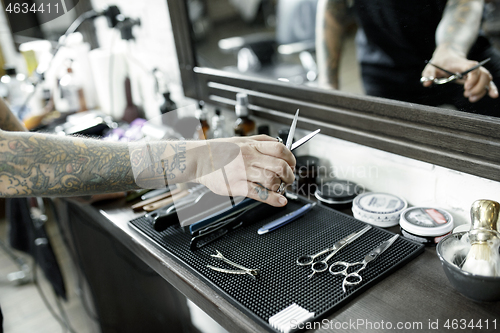 Image of Tools for cutting beard barbershop top view. Vintage tools of barber shop on wooden background