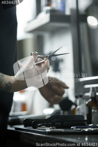 Image of Tools for cutting beard barbershop top view. Vintage tools of barber shop on wooden background