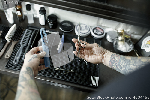 Image of Tools for cutting beard barbershop top view. Vintage tools of barber shop on wooden background