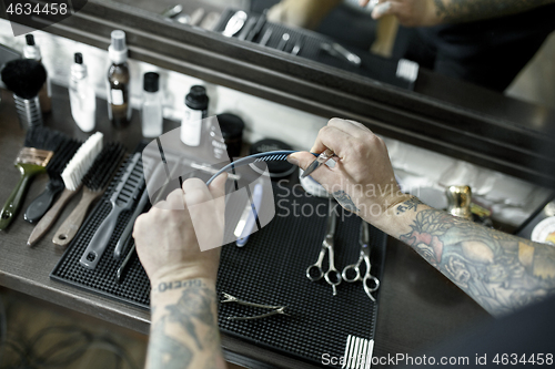 Image of Tools for cutting beard barbershop top view. Vintage tools of barber shop on wooden background