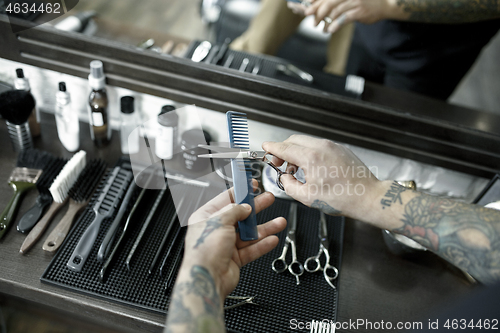 Image of Tools for cutting beard barbershop top view. Vintage tools of barber shop on wooden background