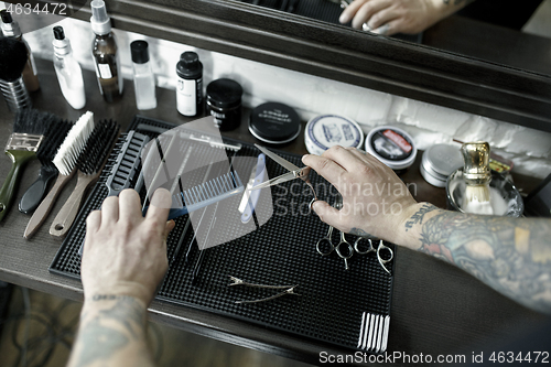 Image of Tools for cutting beard barbershop top view. Vintage tools of barber shop on wooden background