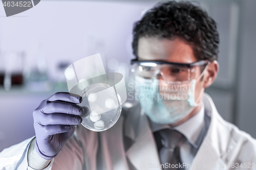 Image of Scientist working in corona virus vaccine development laboratory research facility.