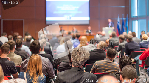 Image of Speaker giving presentation on scientific business conference.