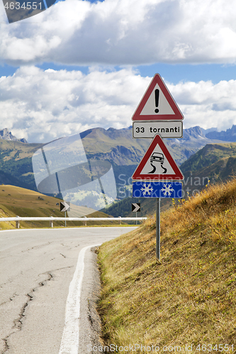 Image of Road sign on a mountain road in Dolomites