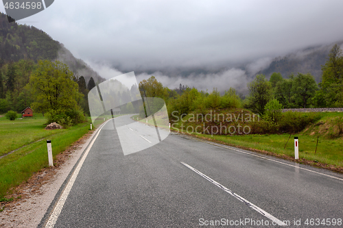 Image of oad in mountains at morning fog